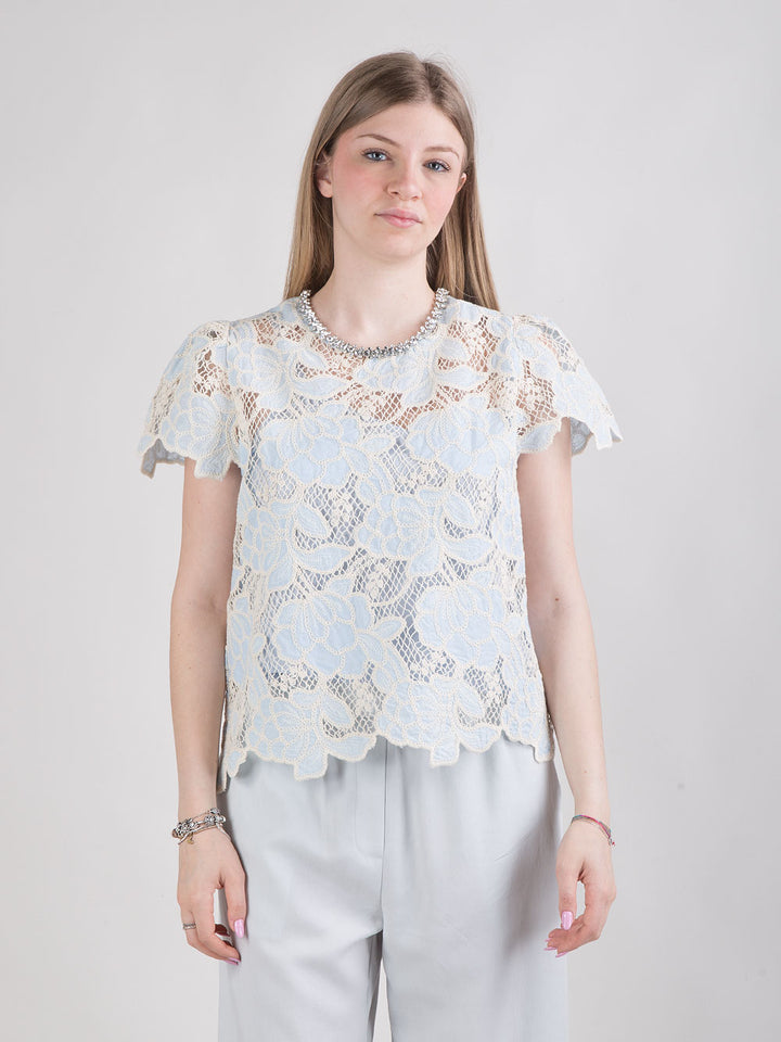 Blusa in pizzo con strass sul collo