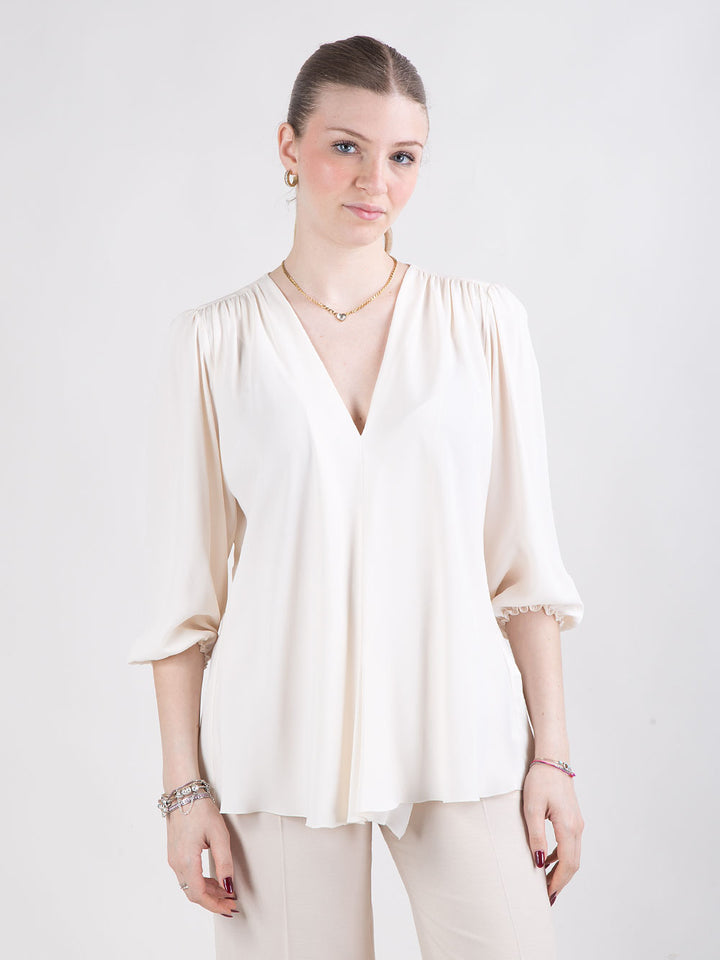 Blusa con scollo a V