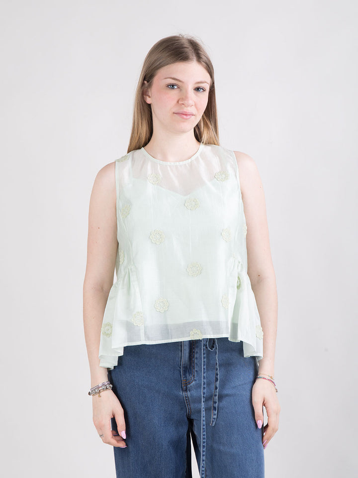 Blusa rosa con fiori a rilievo