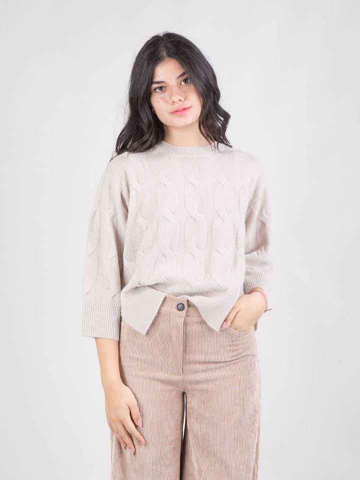 PONCHO IN MAGLIA A TRECCE