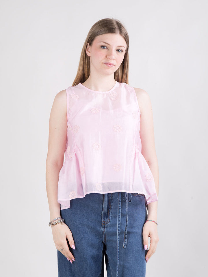 Blusa rosa con fiori a rilievo