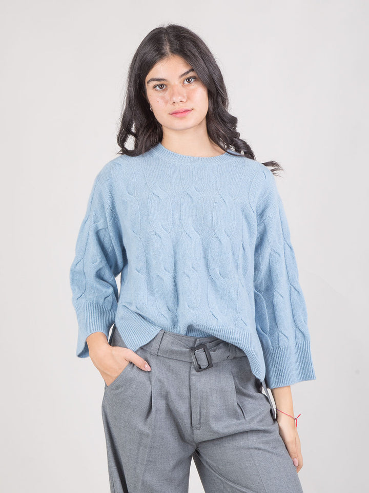 PONCHO IN MAGLIA A TRECCE