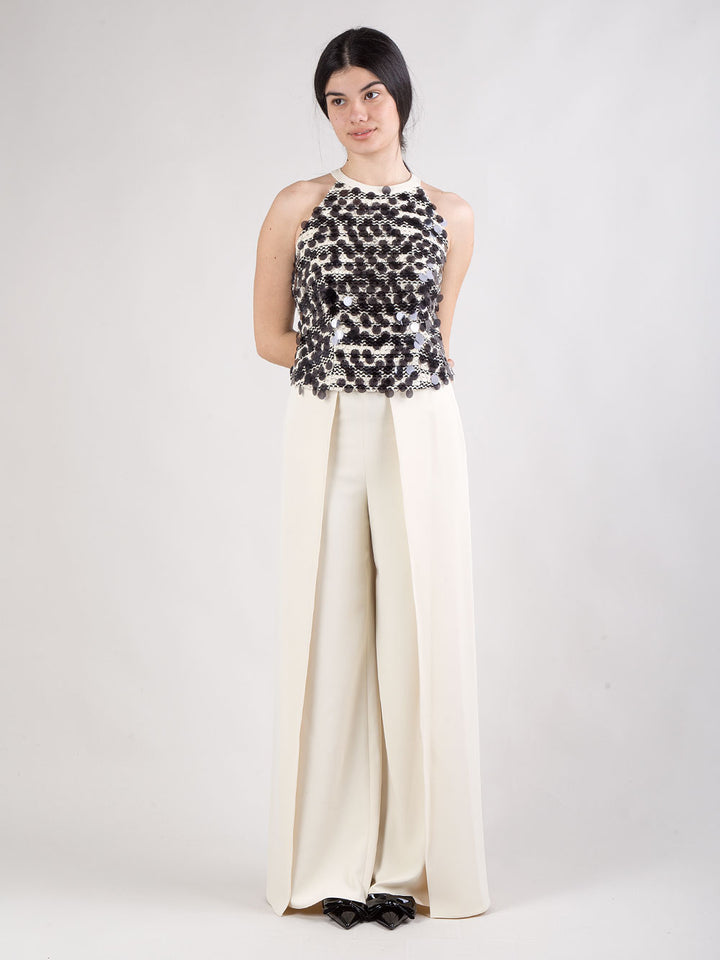 Completo pantalone con spacchi e top con maxi paillettes