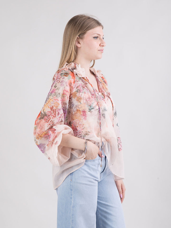 Blusa trasparente a fantasia floreale con top abbinato