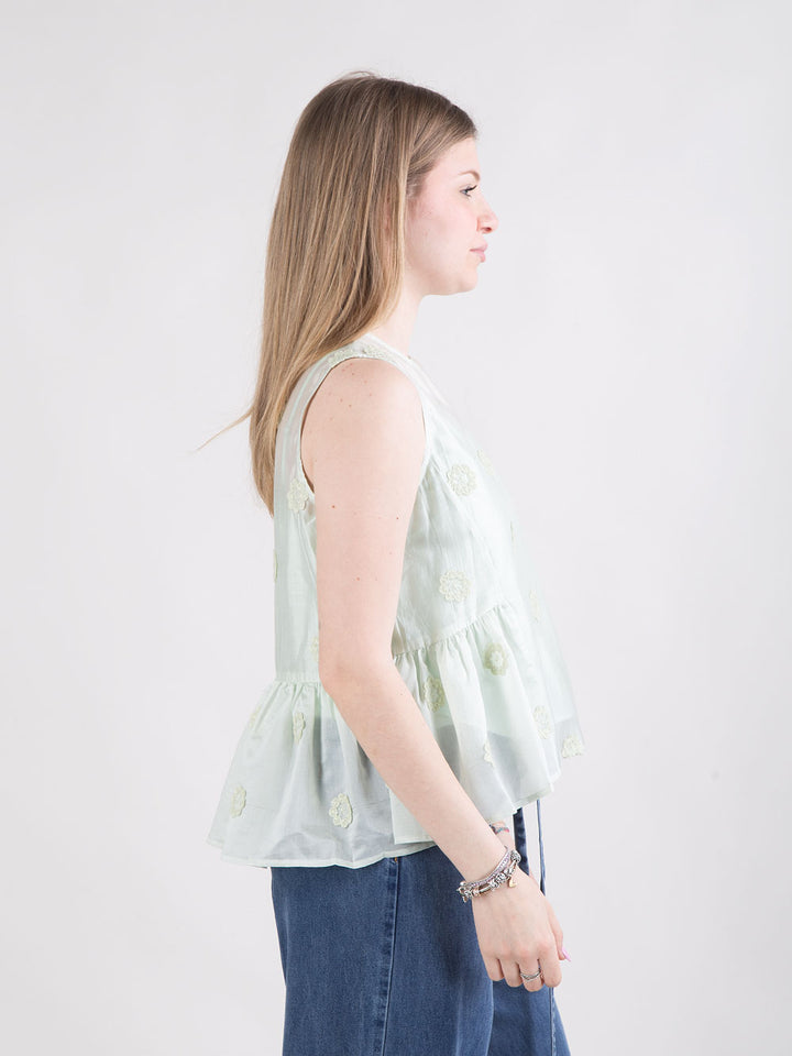 Blusa rosa con fiori a rilievo