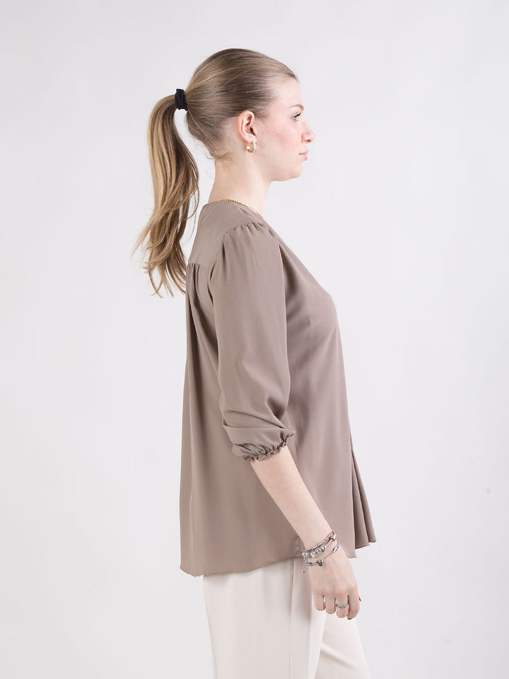 Blusa con scollo a V