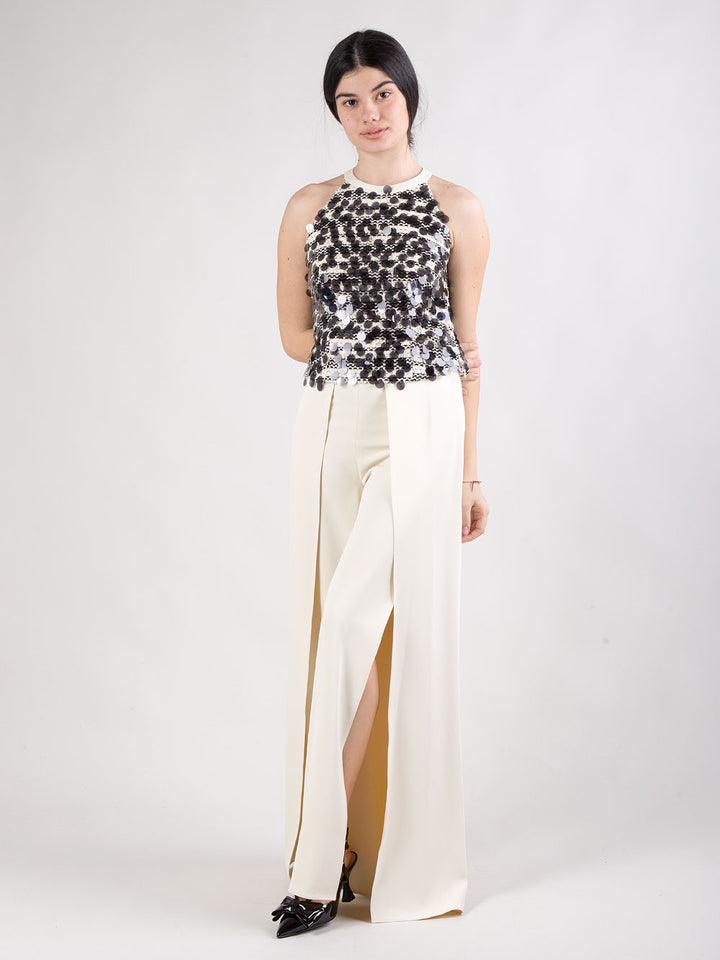 Completo pantalone con spacchi e top con maxi paillettes