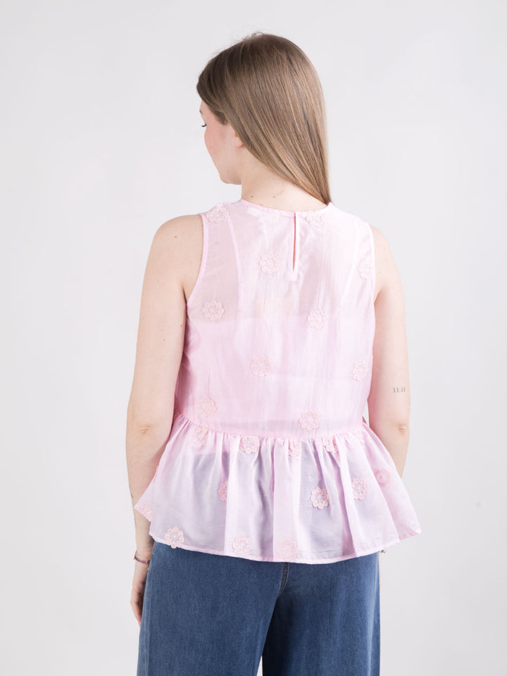 Blusa rosa con fiori a rilievo