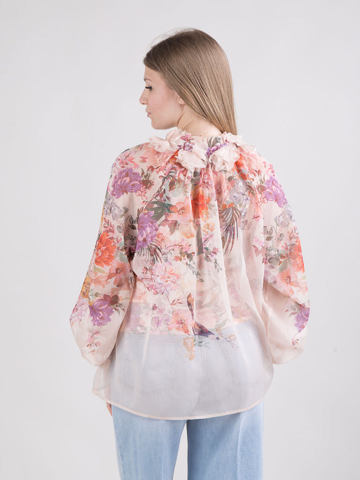 Blusa trasparente a fantasia floreale con top abbinato