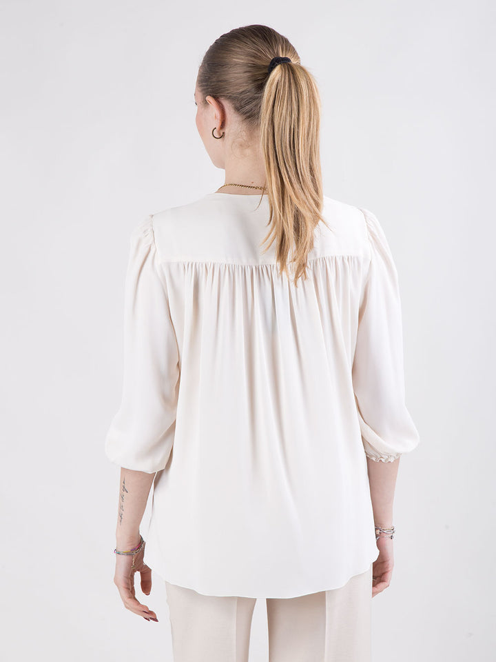 Blusa con scollo a V
