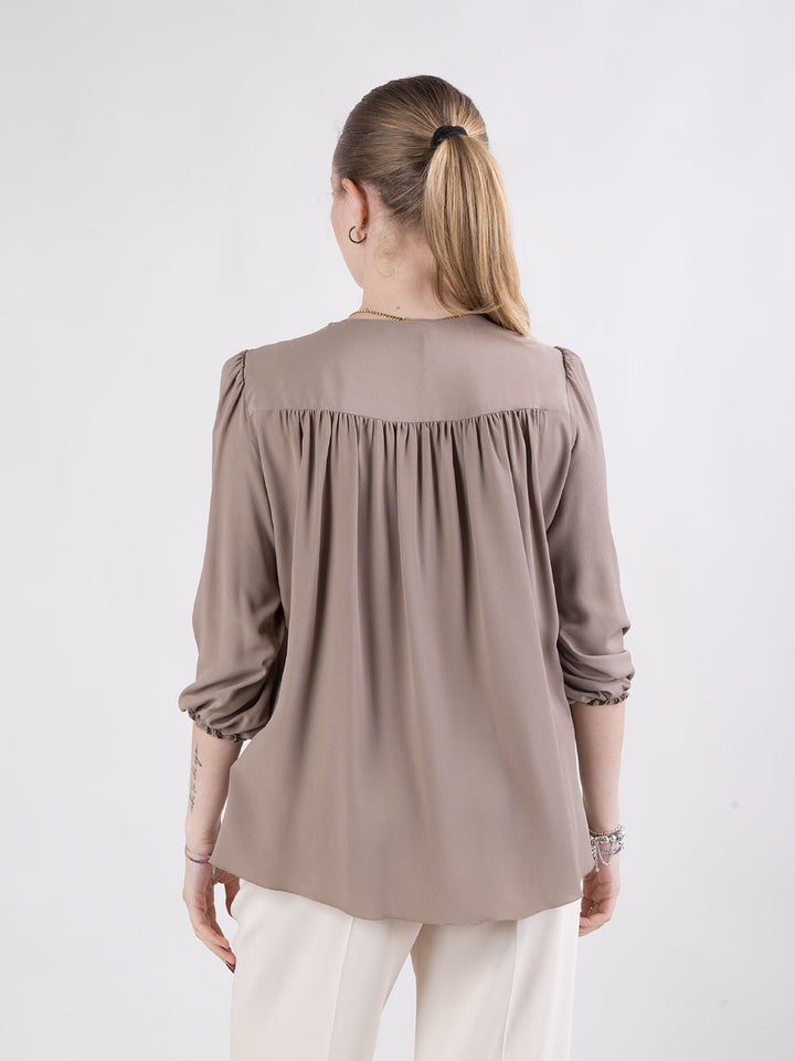 Blusa con scollo a V