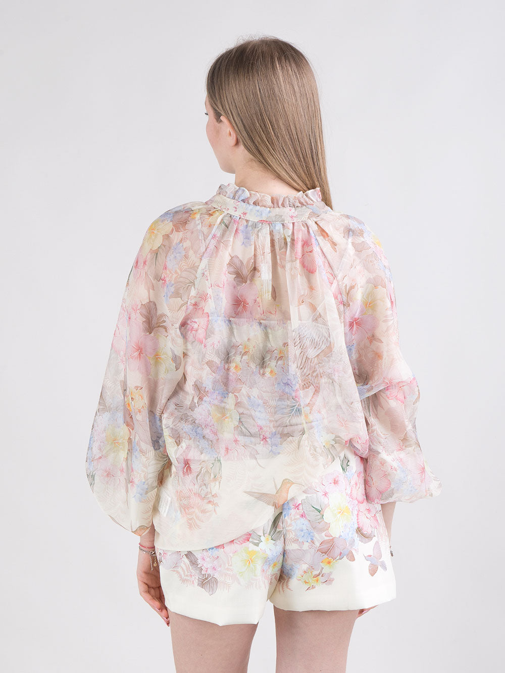 Blusa fantasia floreale e uccelli