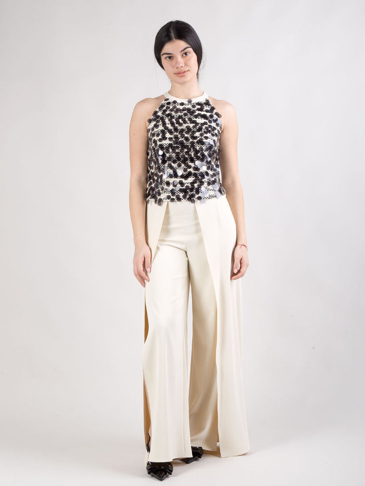 Completo pantalone con spacchi e top con maxi paillettes