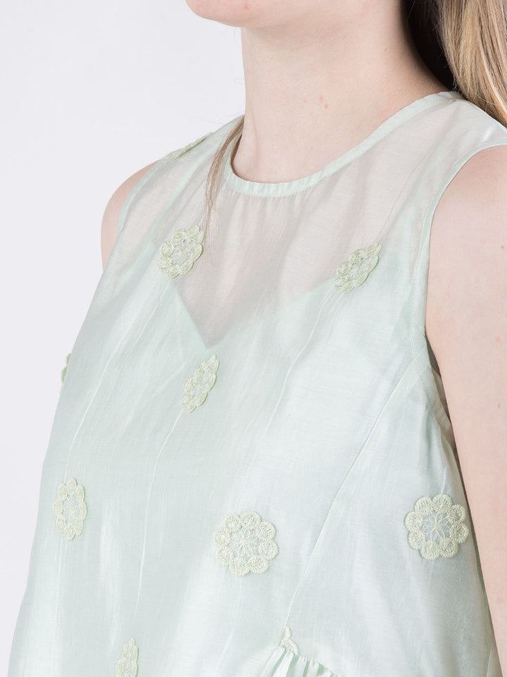 Blusa rosa con fiori a rilievo