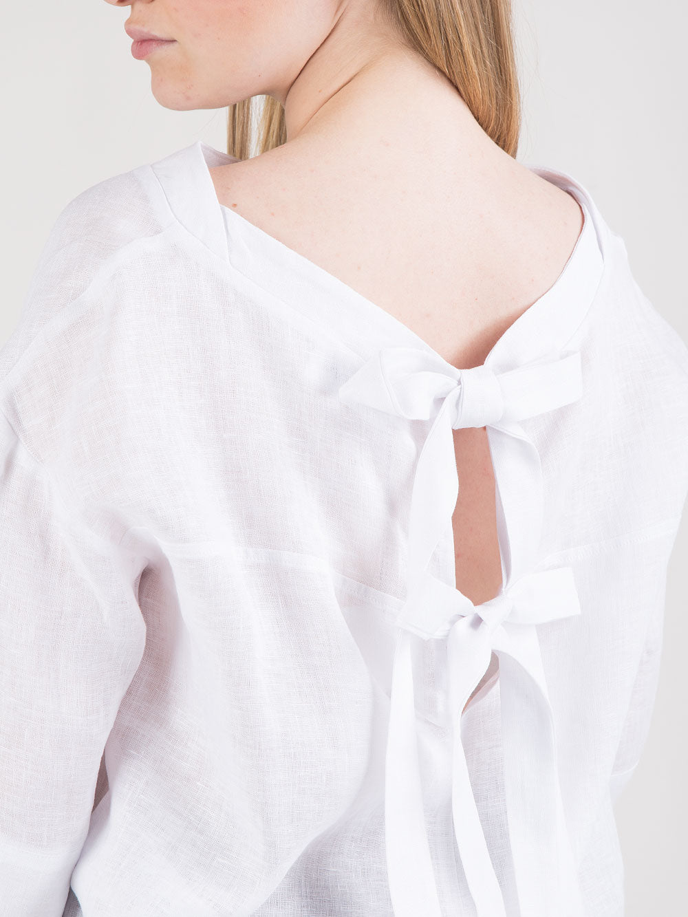 Blusa over in lino con fiocco