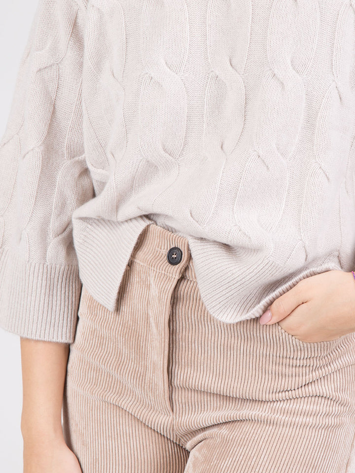 PONCHO IN MAGLIA A TRECCE