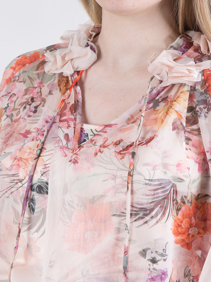 Blusa trasparente a fantasia floreale con top abbinato