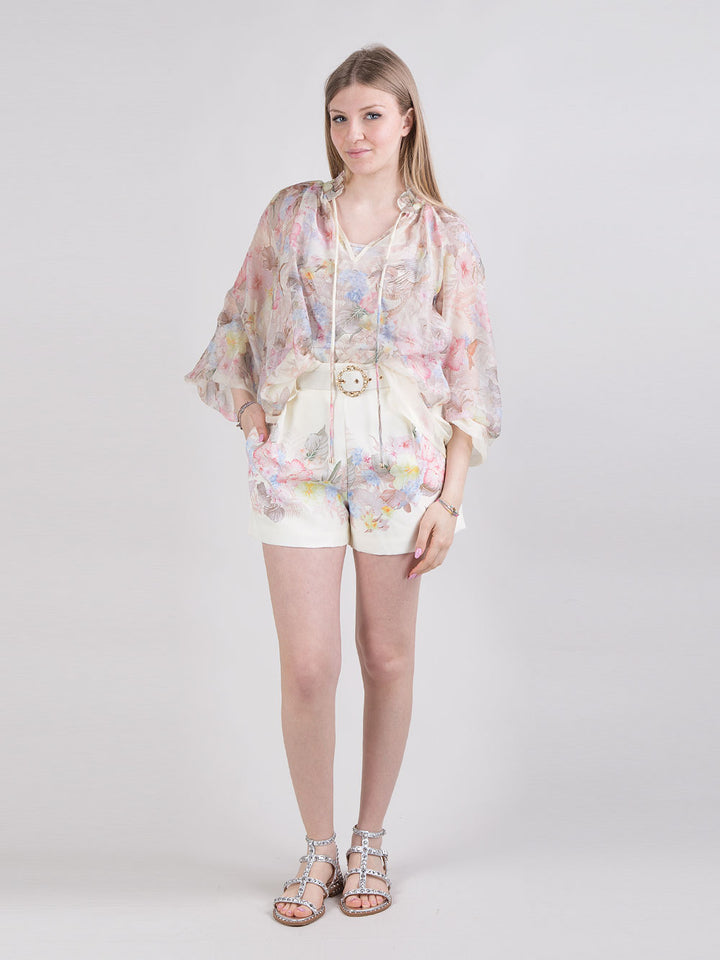 Blusa fantasia floreale e uccelli