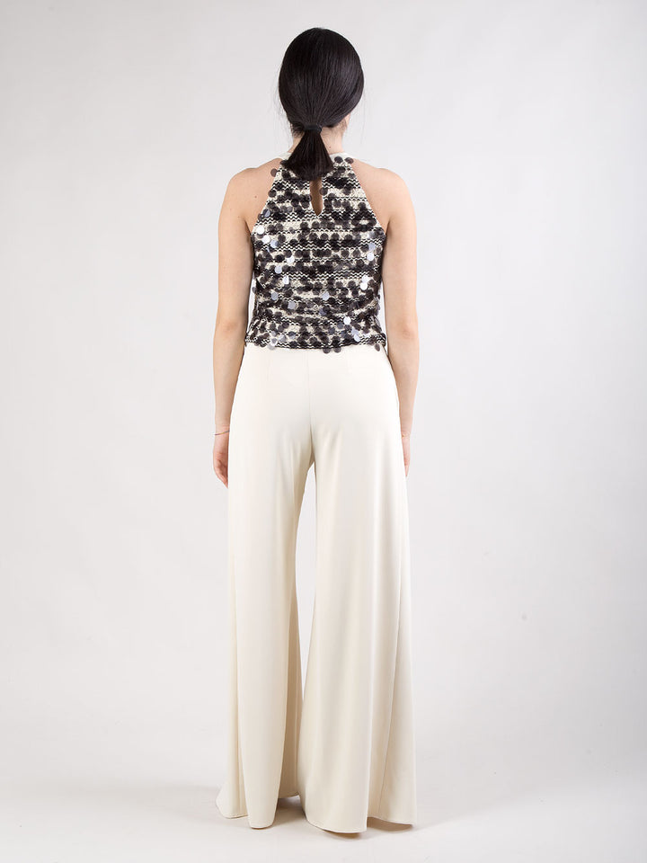 Completo pantalone con spacchi e top con maxi paillettes